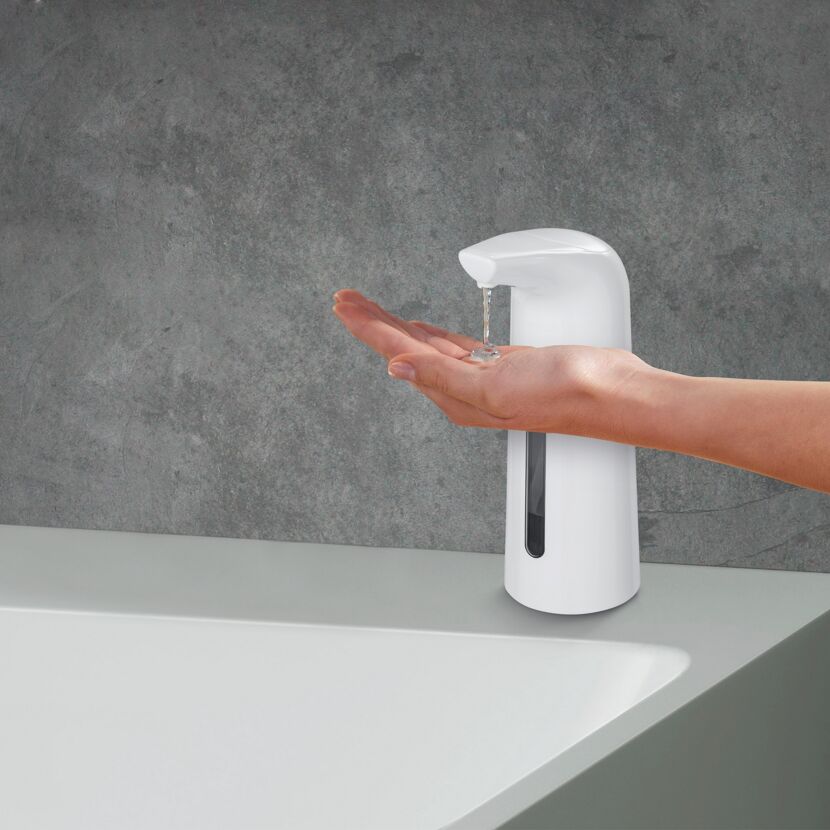 Seifenspender mit Hand darunter