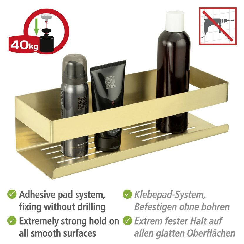 Goldene Duschablage mit Badutensilien