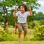 Spielhaus 'Lolla 2' naturfarben/rot mit Rutsche und Schaukel 352 x 280 x 224 cm