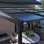 Terrassenüberdachung 'Budavar 1012' schwarz mit Moskitonetzen und Vorhängen 366 x 299 x 243 cm