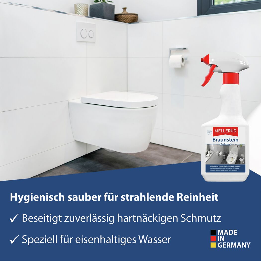 Braunsteinentferner Sprühflasche vor einer Toilette im Bad