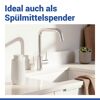 Cremefarbener Seifenspender 'Fablo' an der Spüle.