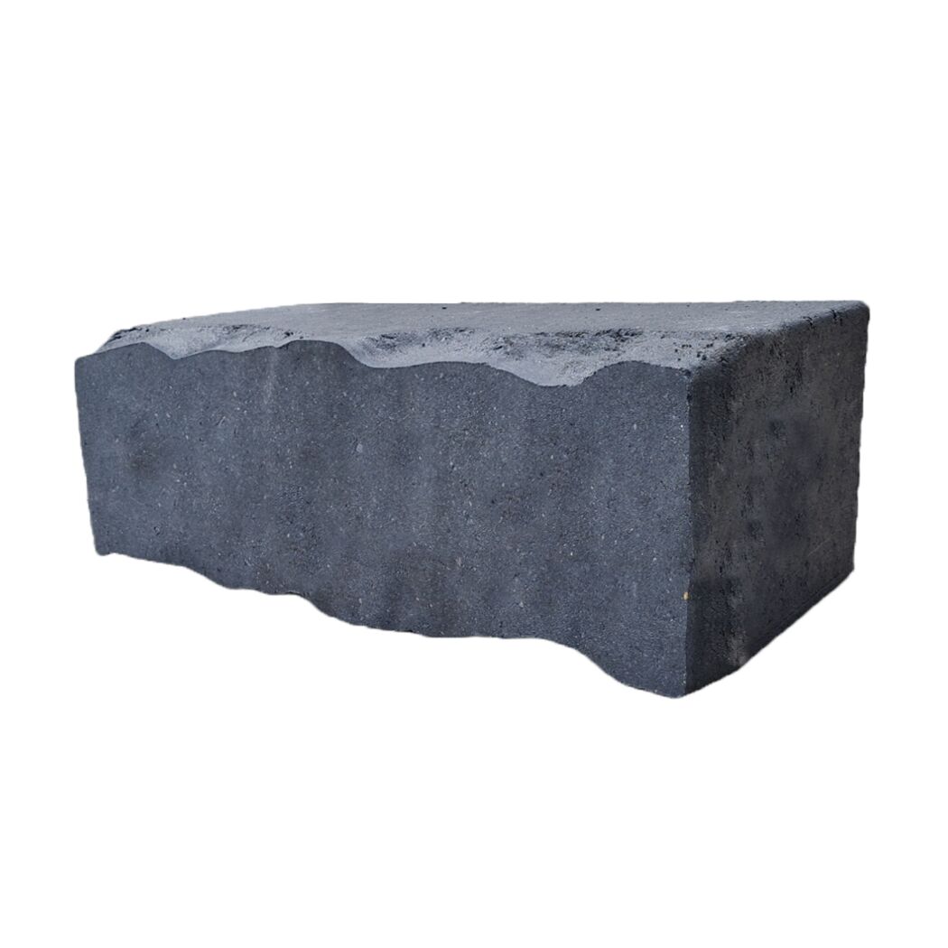 Basaltfarbener Mauerstein mit wellenförmiger Oberfläche