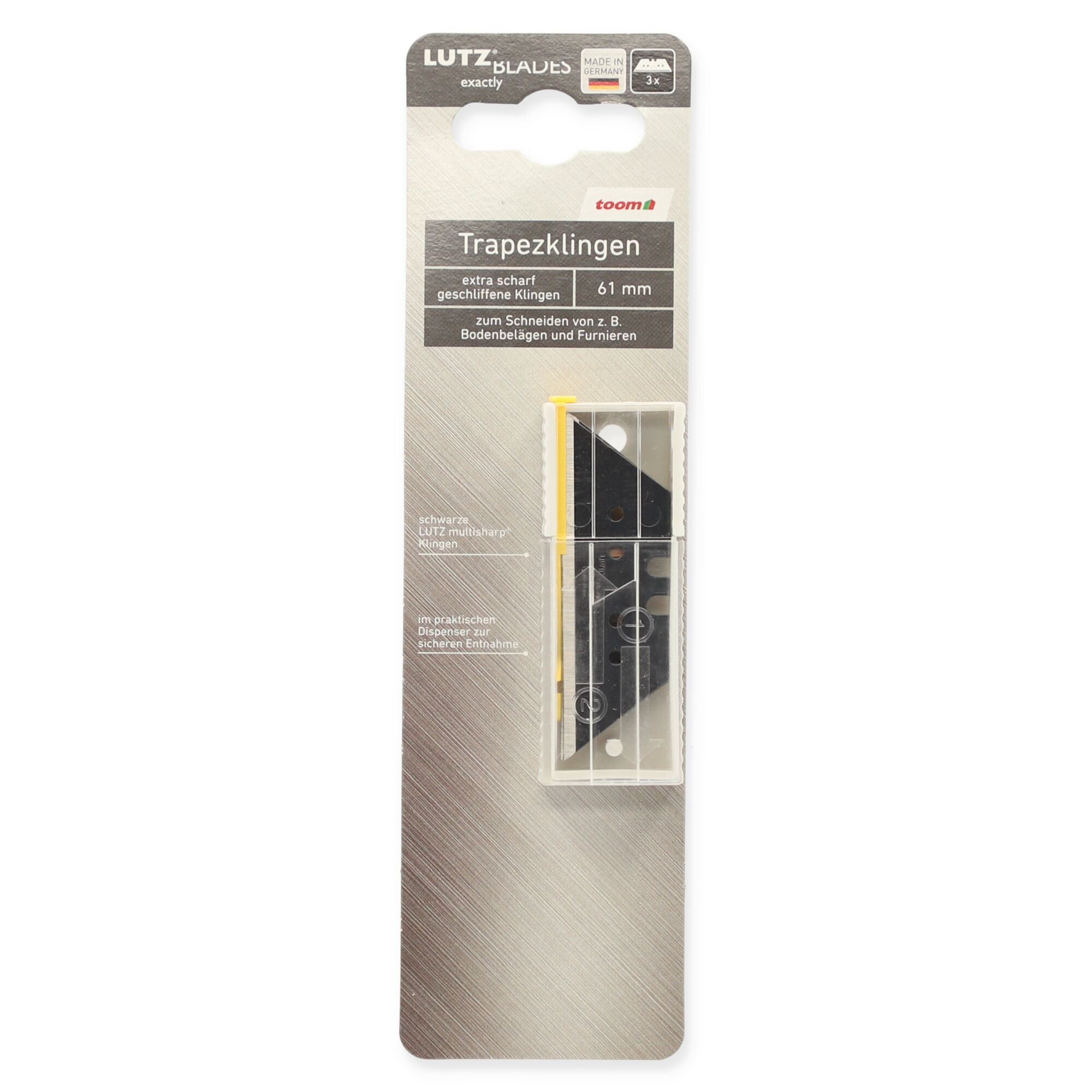 Drei Trapezklingen im transparenten Dispenser.