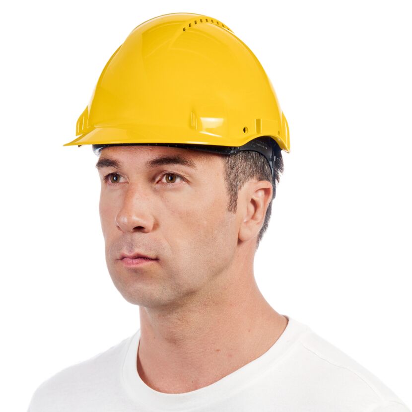 Person mit gelbem Schutzhelm