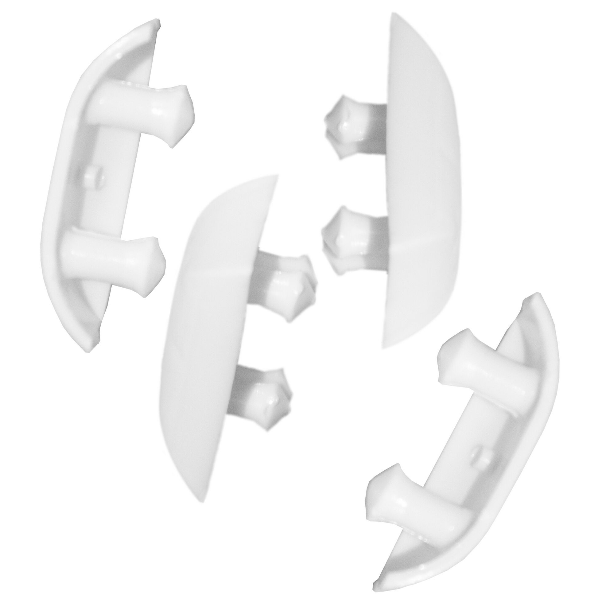 Vier weiße Wasserablaufkappen