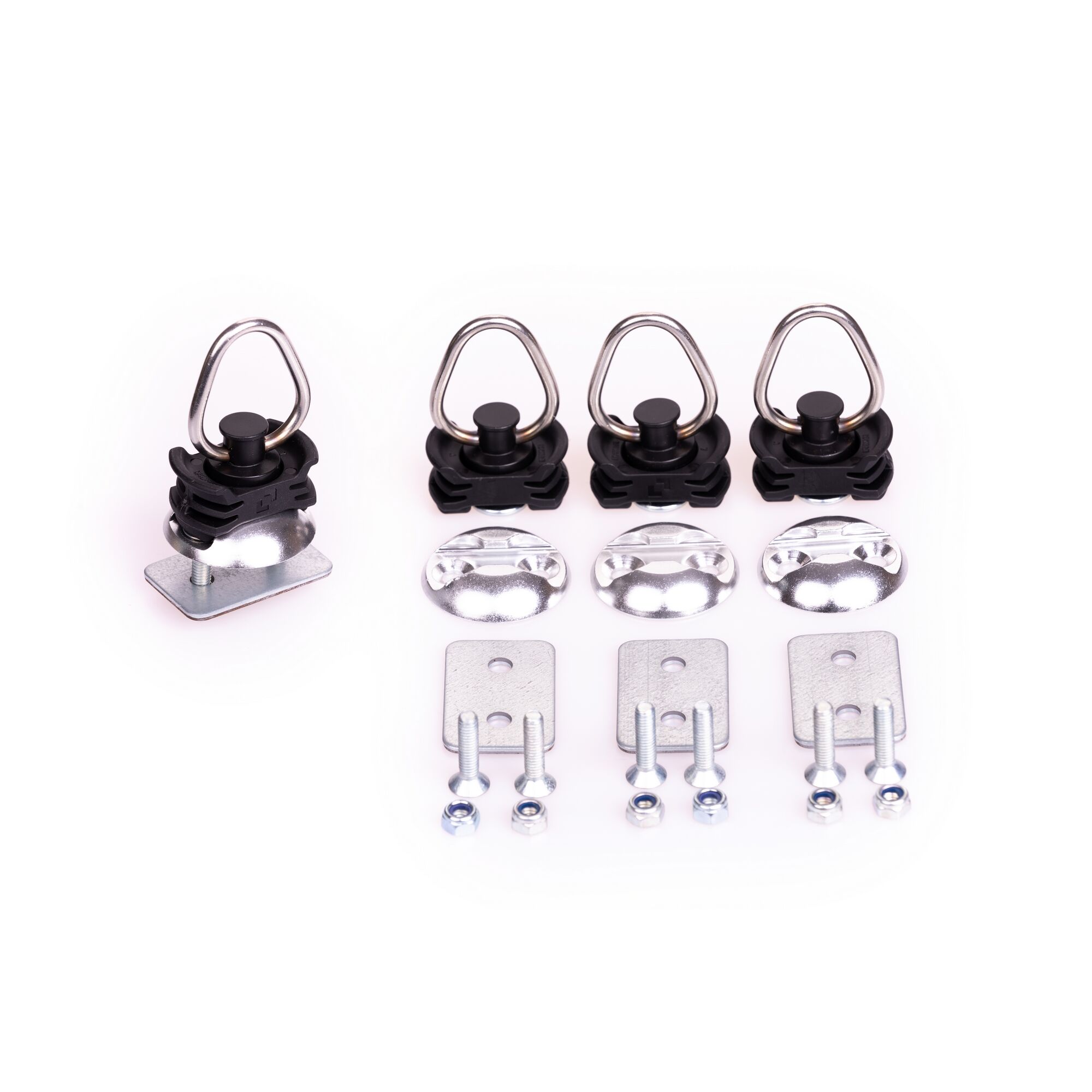 Vier Zurrpunkte mit Schrauben und Muttern