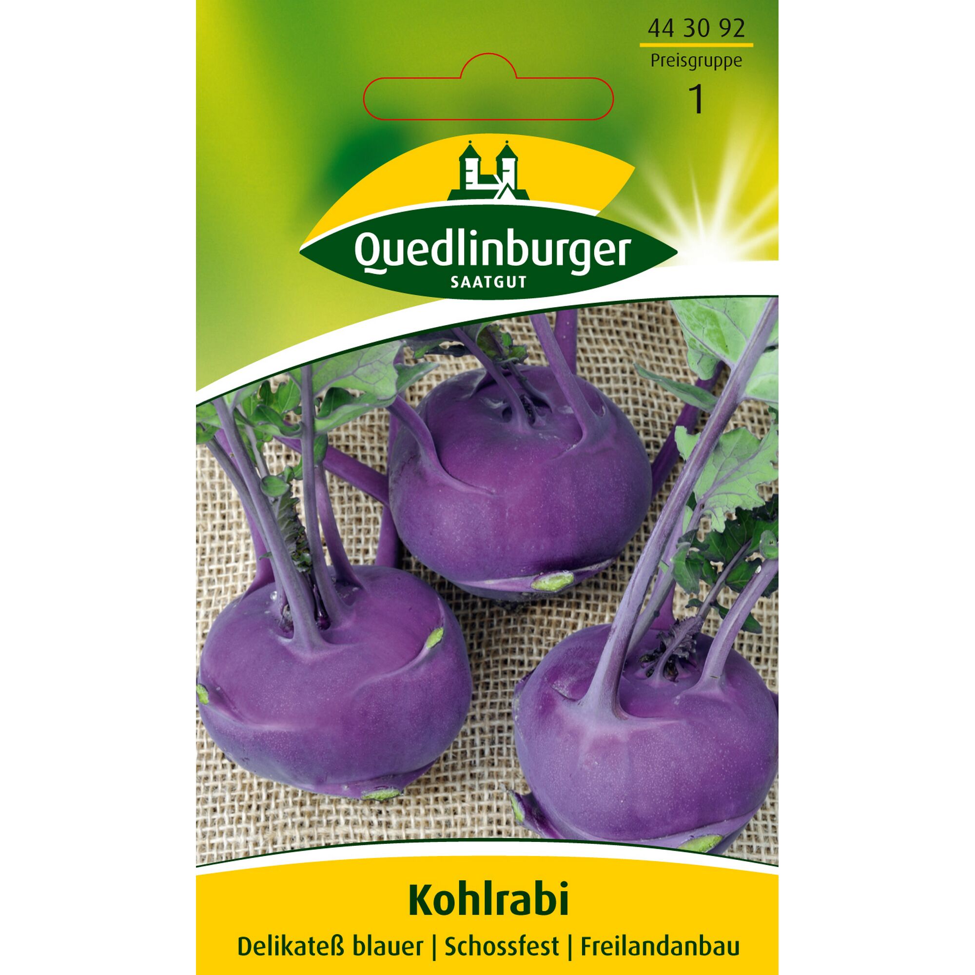 Drei violette Kohlrabi auf Juteuntergrund.