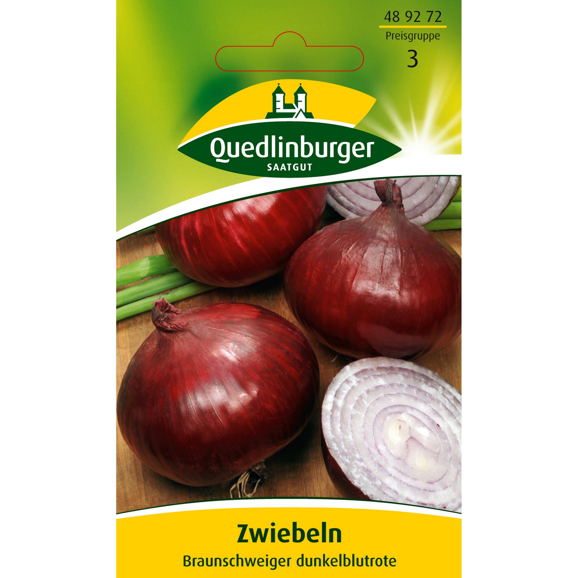Braunschweiger Dunkelblutrote Zwiebeln, drei ganze und eine halbierte auf einem Holzbrett