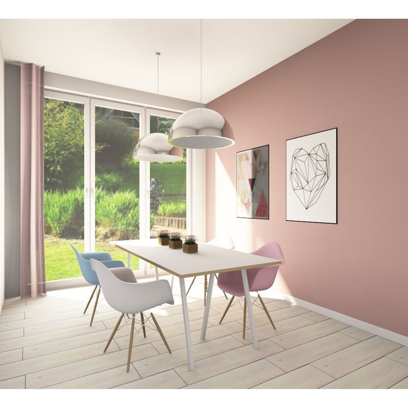 Esszimmer mit hellem Holzboden und rosa Wand
