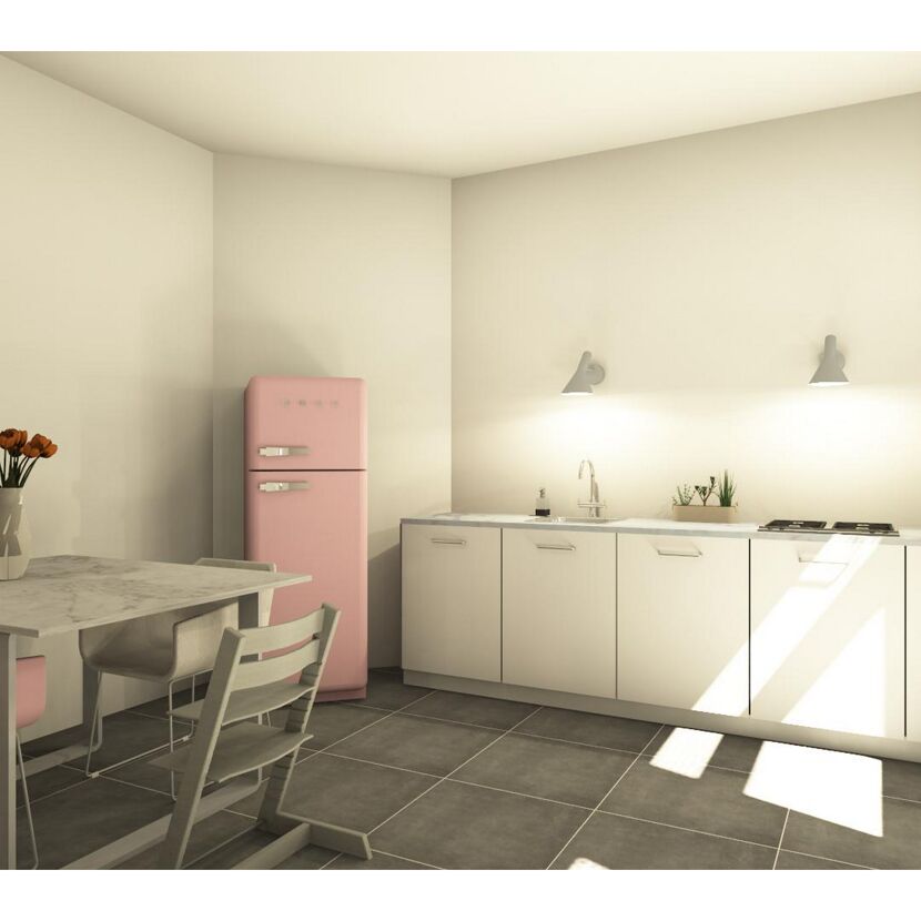 Küche mit rosa Kühlschrank und Esstisch