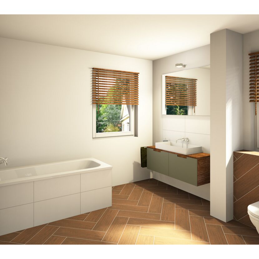 Modernes Badezimmer mit Badewanne, Waschbecken und WC.