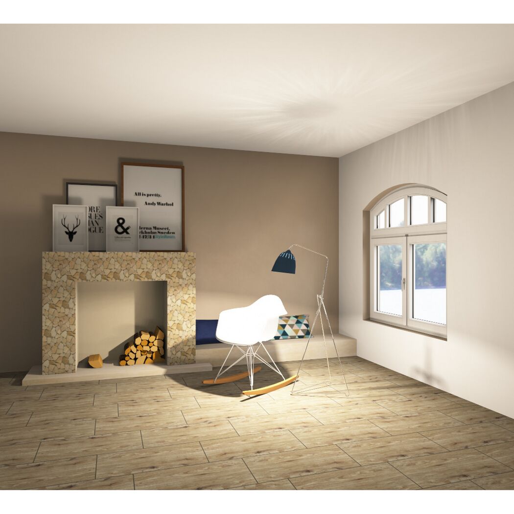 Wohnzimmer mit Kamin, Schaukelstuhl und Dekorationen.