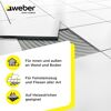 Fliese wird mit Fliesenkleber verlegt