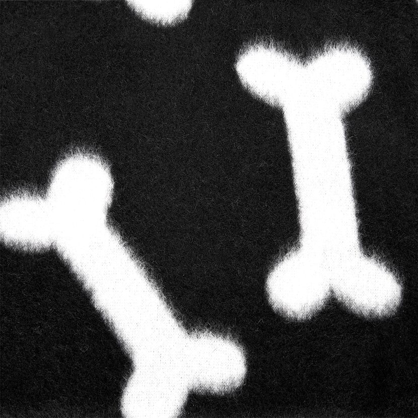 Schwarze Hundedecke mit weißen Knochen