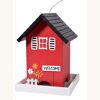 rotes Vogelhaus mit Willkommensschild