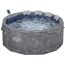 Runder, grauer Whirlpool mit Sprudel