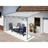 Weißer Terrassenüberdachung mit Tisch und Stühlen darunter