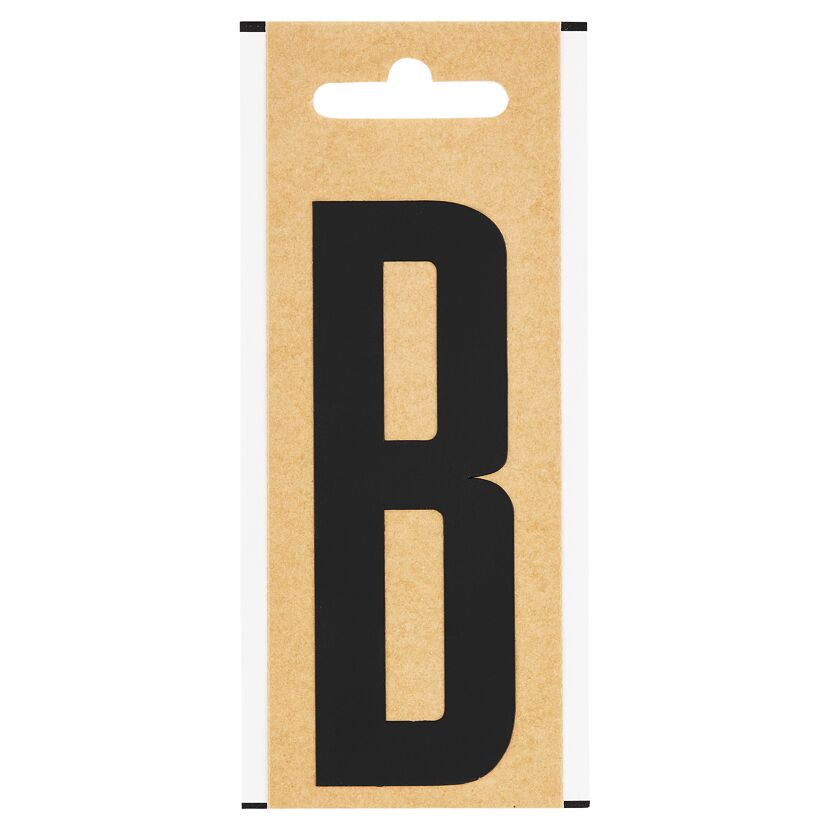 Schwarzer Folienbuchstabe B auf braunem Karton