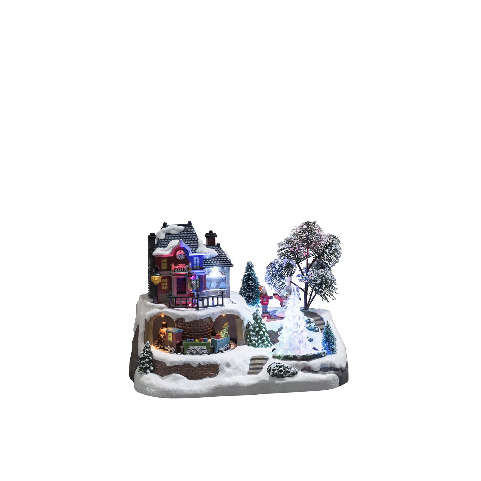 Beleuchtete Winterlandschaft mit Weihnachtsbahnhof, Zug und Eisbahn.
