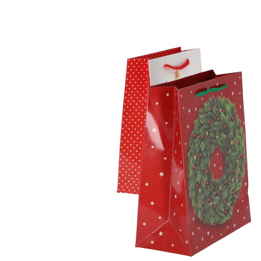 Drei rote Geschenktüten mit weihnachtlichen Motiven.