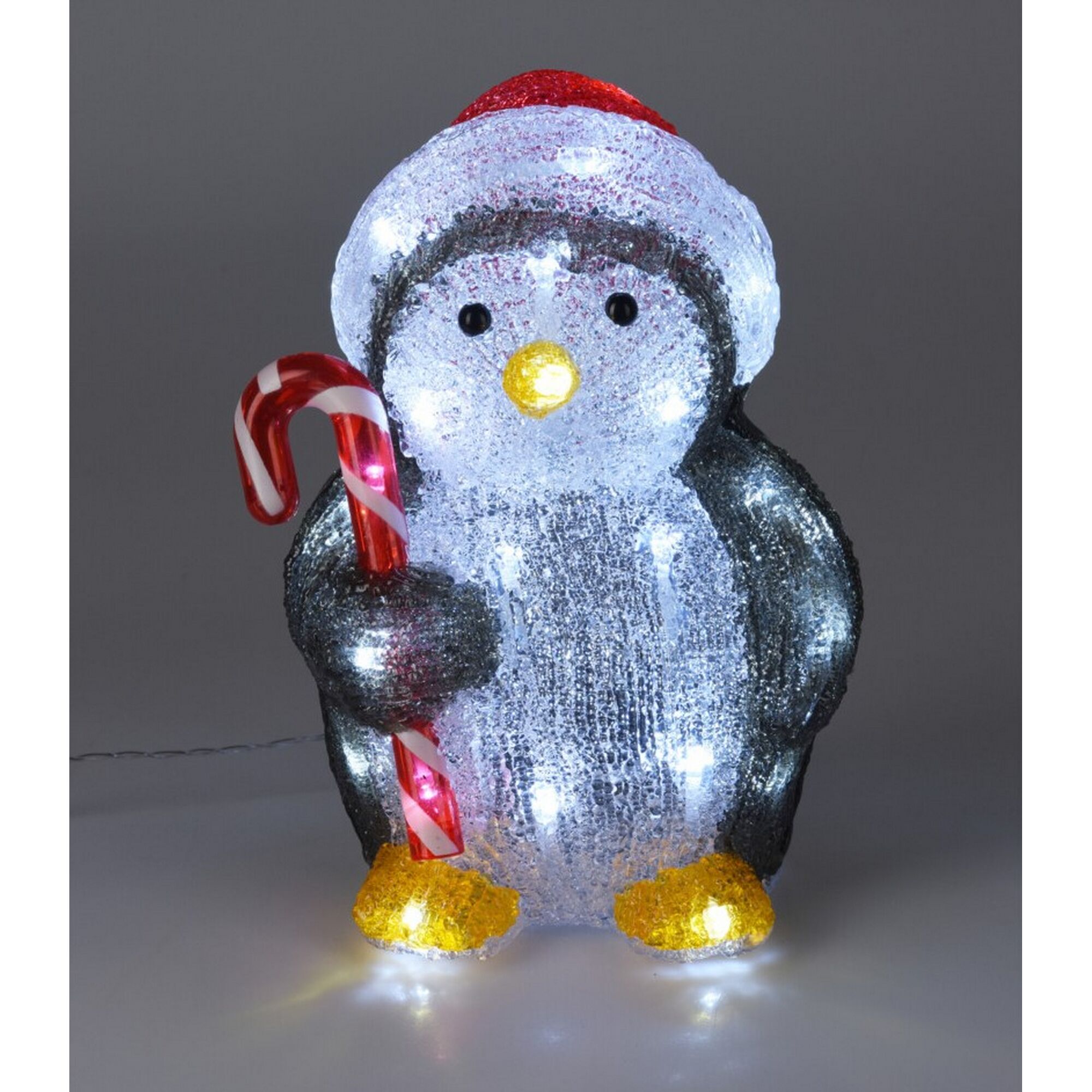 Vier weihnachtliche Tierfiguren mit Zuckerstangen