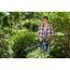 Person schneidet Hecke mit GARDENA Elektro-Heckenschere