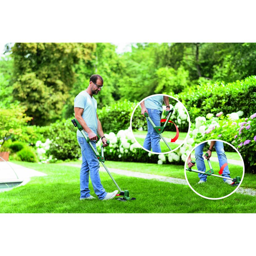 Person kürzt Rasen mit Rasentrimmer