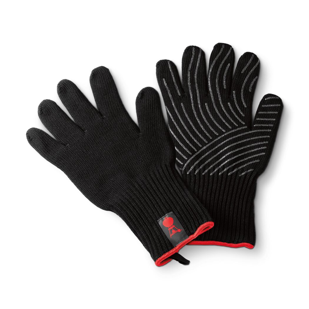 Ein Paar schwarze Grillhandschuhe mit roter Paspelierung und Silikonstreifen.