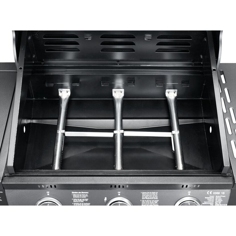 Innenraum eines Gasgrills mit drei Brennern