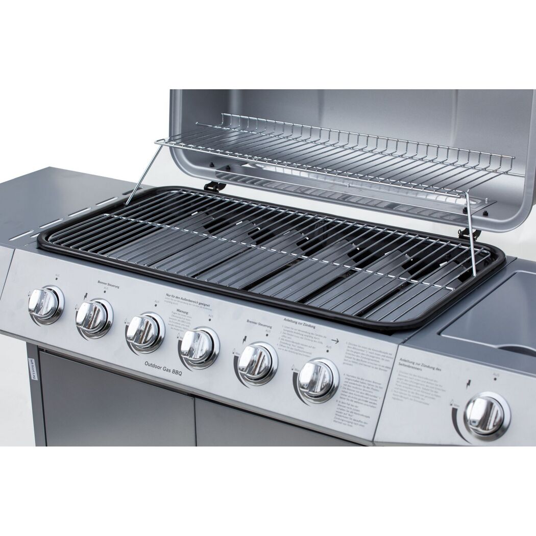 Gasgrill mit geöffnetem Deckel und vier Drehreglern