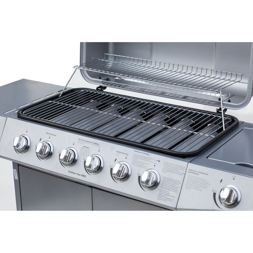 Gasgrill mit geöffnetem Deckel und vier Drehreglern