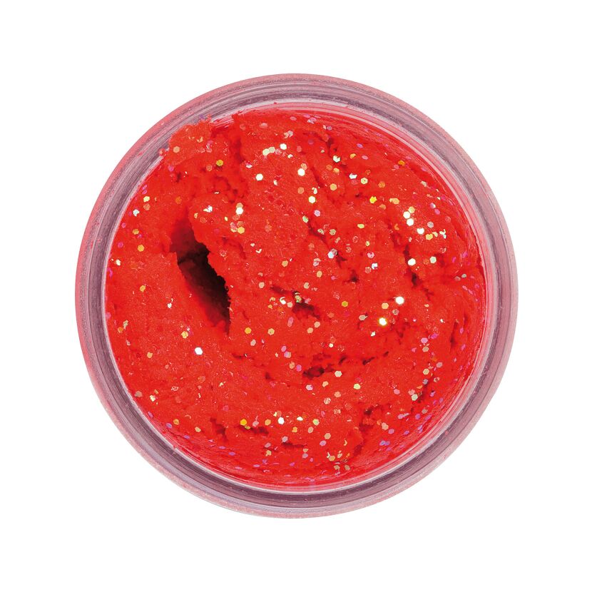 Roter Forellenköder mit Glitzer im Glas.