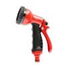 Rote Gartenbrause mit schwarzem Griff