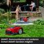Roter Hauswasserautomat am Gartenteich