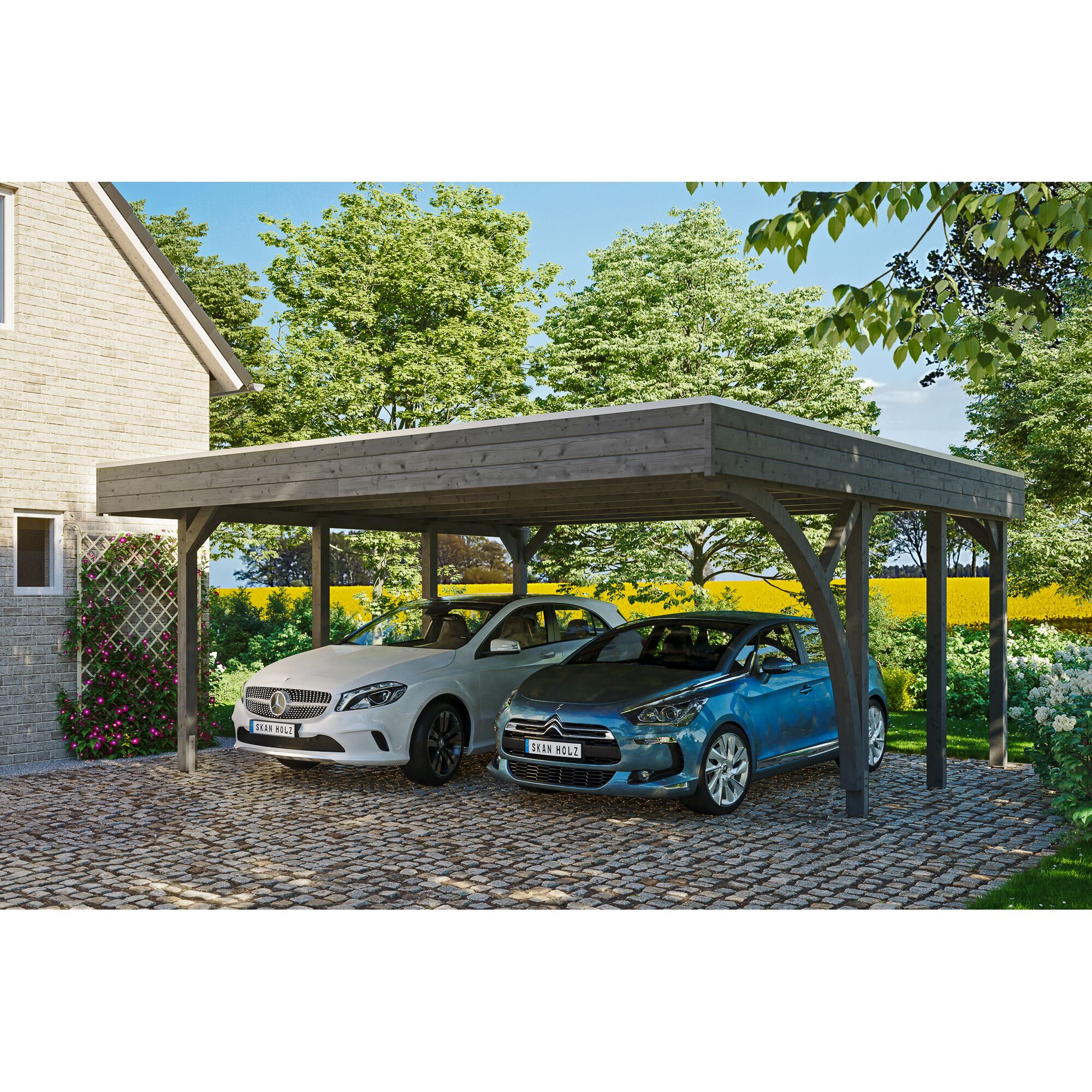 Zwei Autos unter einem grauen Carport.