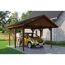 Person parkt gelbes Auto unter einem braunen Carport