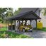 Person parkt gelbes Auto unter Carport