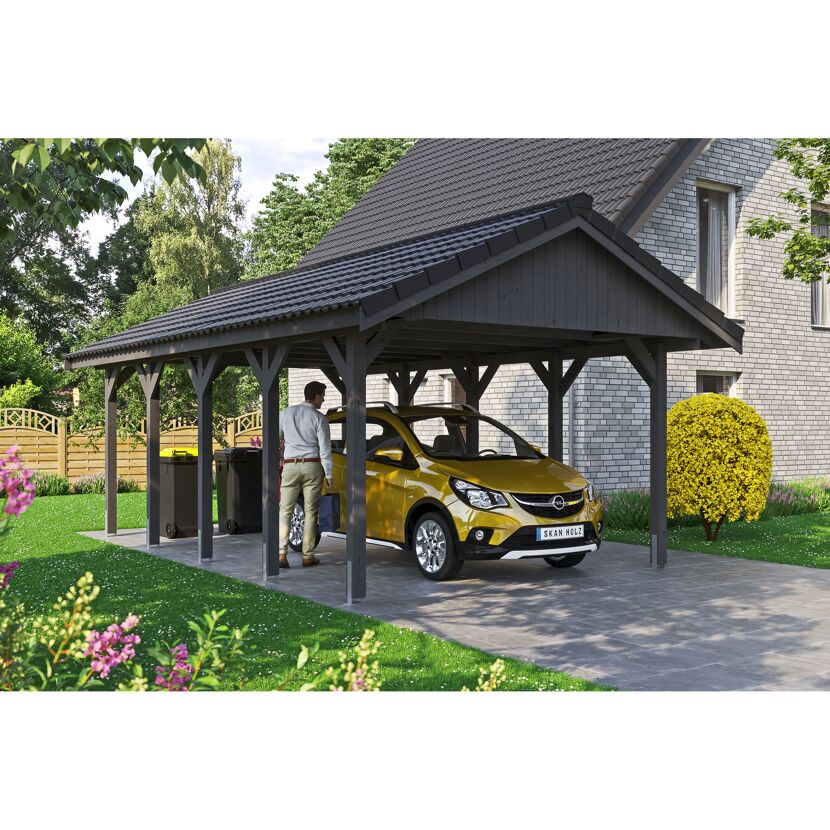 Person parkt gelbes Auto unter Carport