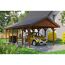 Person parkt gelbes Auto unter Carport