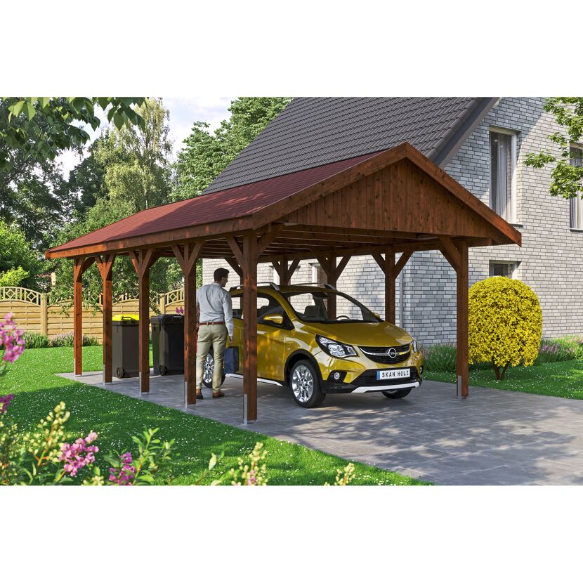 Person parkt gelbes Auto unter einem braunen Carport.