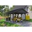Person parkt gelbes Auto unter Carport