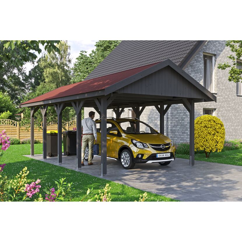 Auto steht unter einem grauen Carport