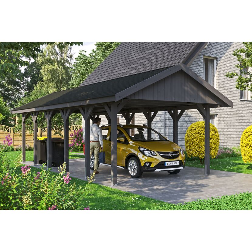 Ein Auto parkt unter einem Carport.
