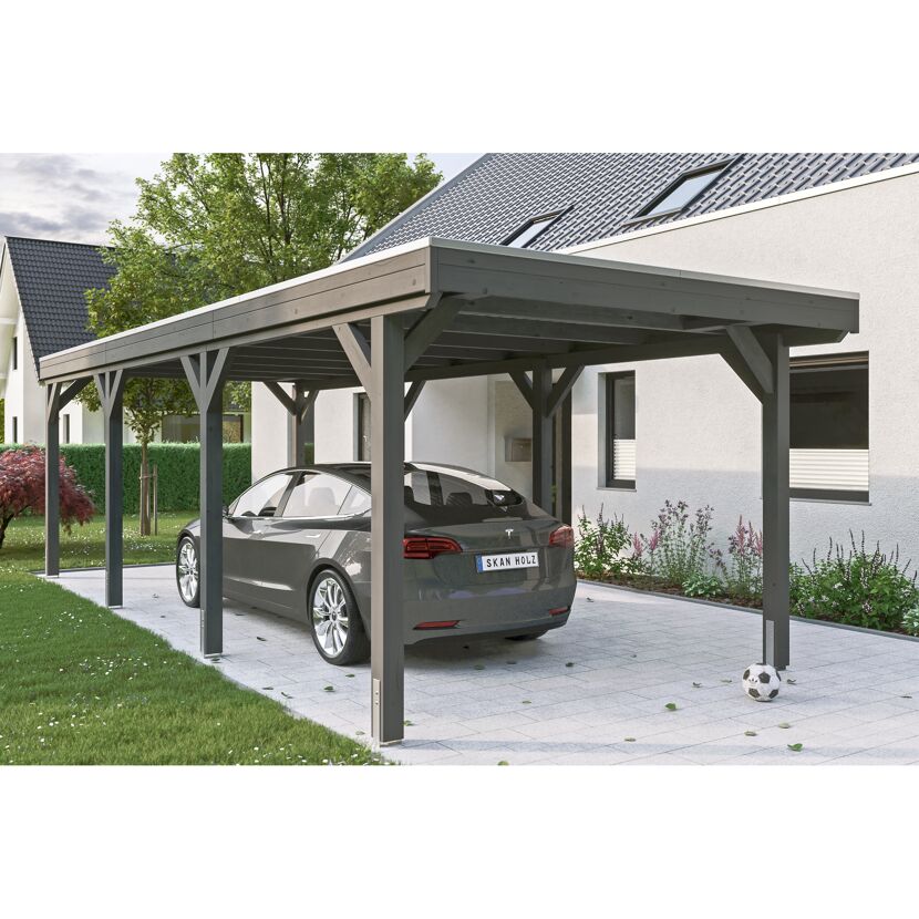 Auto steht unter einem grauen Carport.