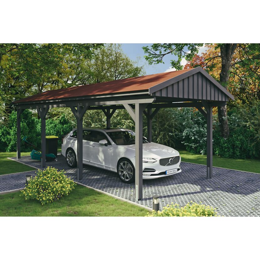 Auto steht unter einem grauen Carport.