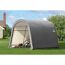 Gerätehaus ShelterLogic grau im Garten, Rasenmäher darin