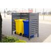 Gelbe und blaue Mülltonne in grauer Mülltonnenverkleidung