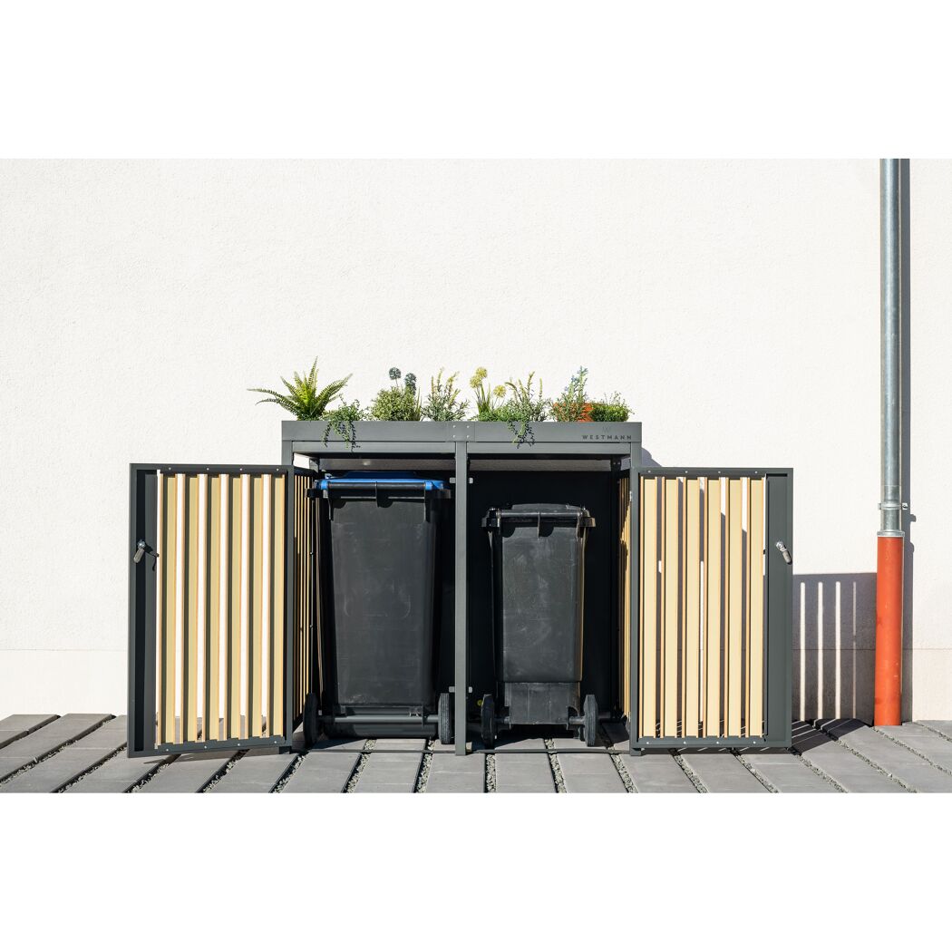 Zwei schwarze Mülltonnen in einer Mülltonnenbox von Westmann.