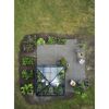 Gewächshaus Qube Square im Garten
